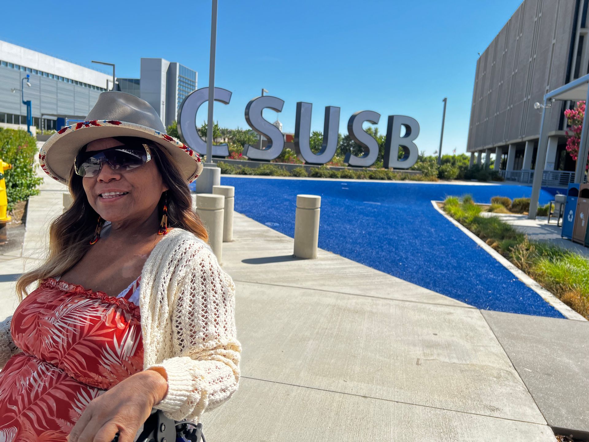 Bladder cancer patient outside the hospital where she received treatment, thanks to gas cards