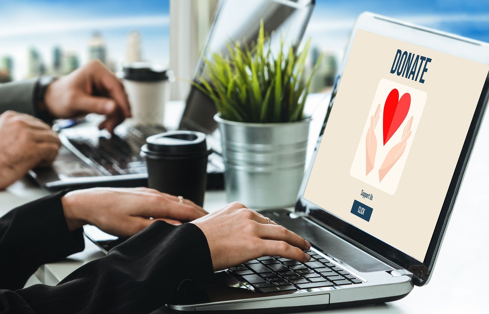 A group of people are sitting around a large piece of paper that says `` charity ''.