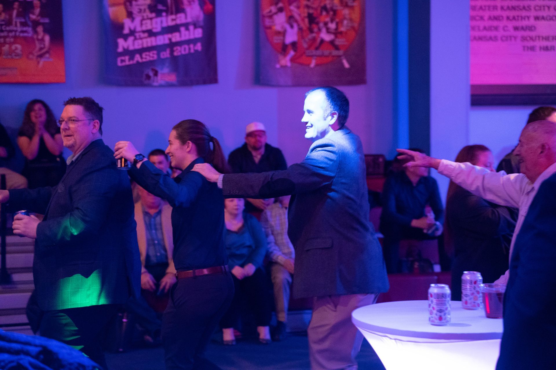 people line dancing at the party.