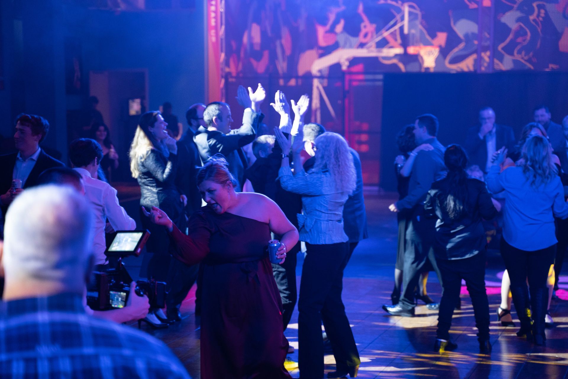 People are standing and clapping while they listen to the music