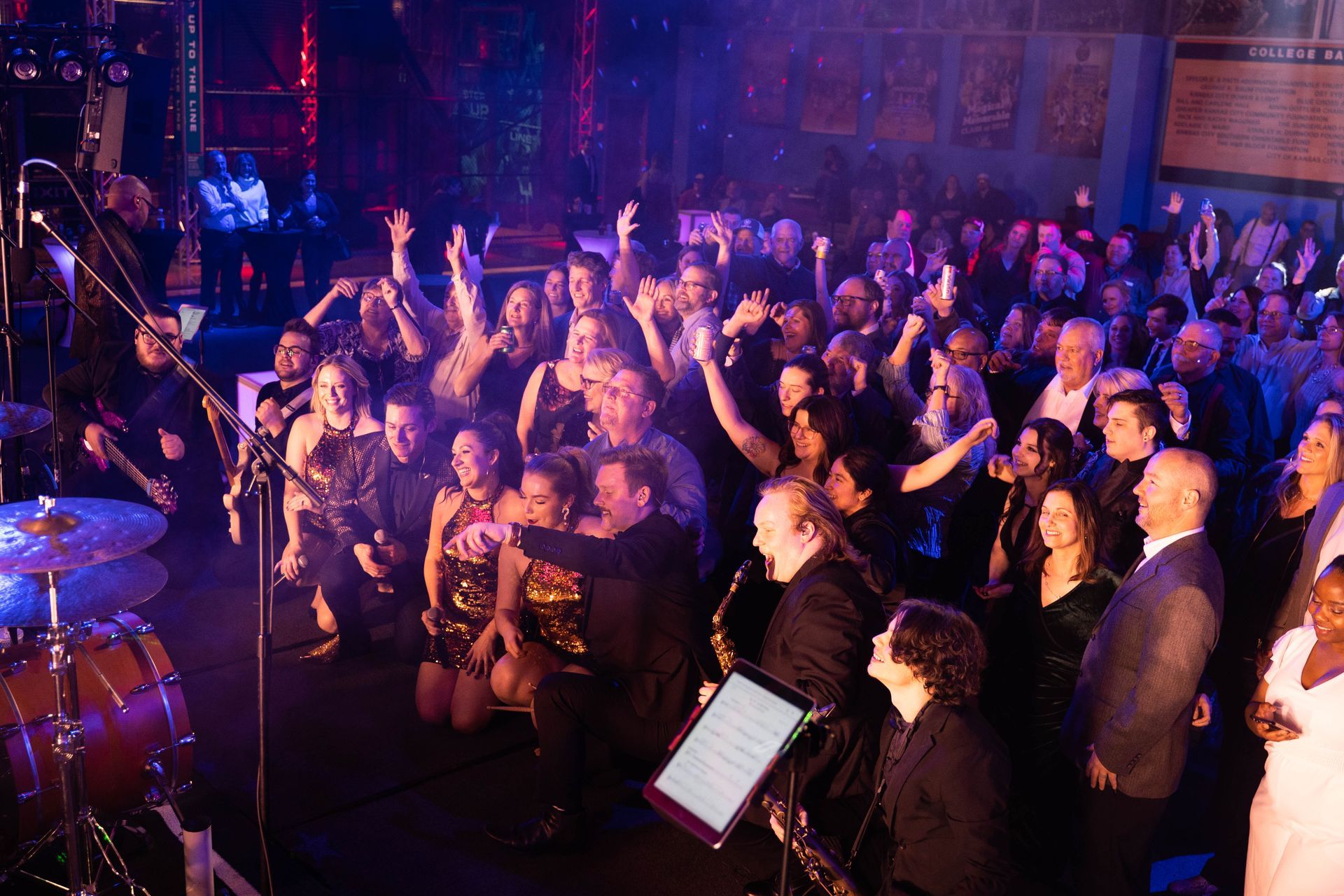 Full dance floor of people who are enjoying the party.