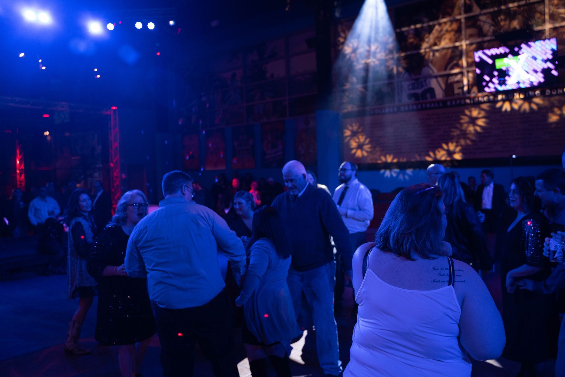 people dancing on the dance floor.