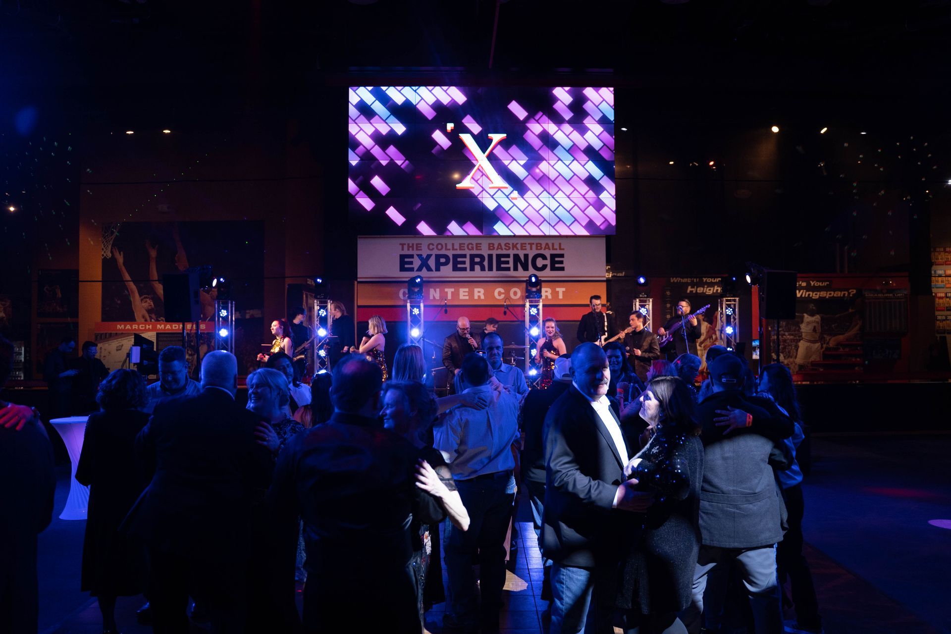 People dancing and talking at the 100year anniversary party for ICL