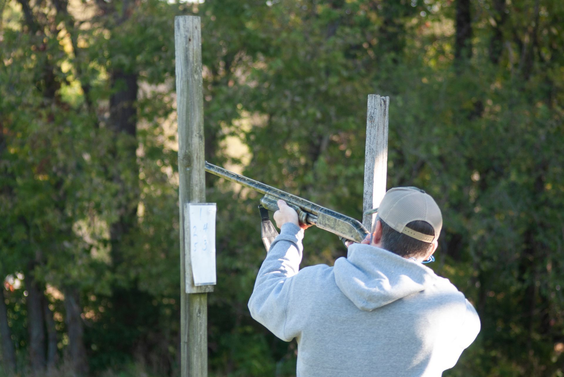A man is skeet shooting.