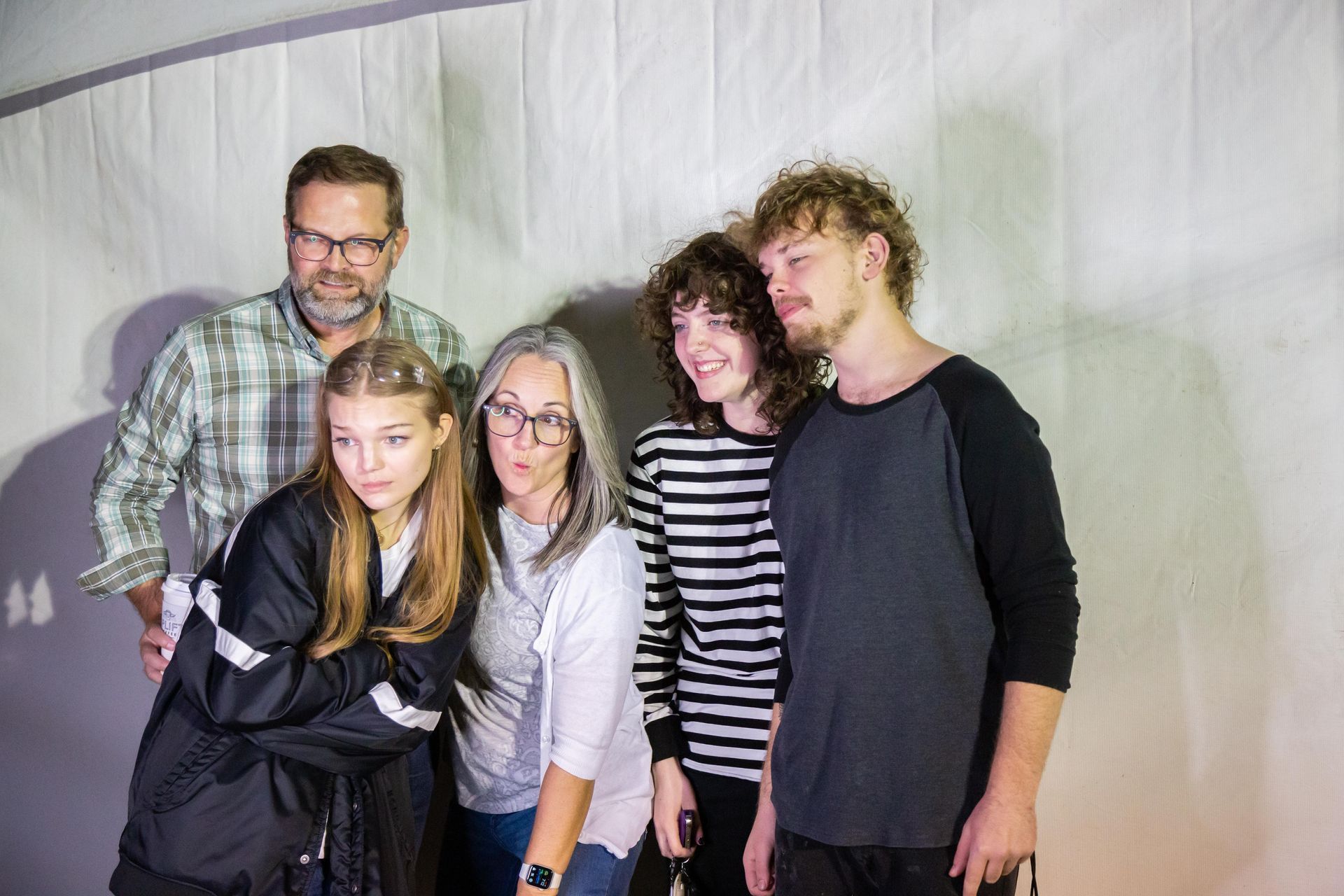 A family poses for the camera.
