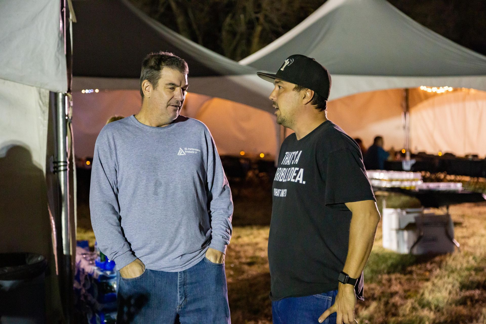 ICL family members are standing around talking.