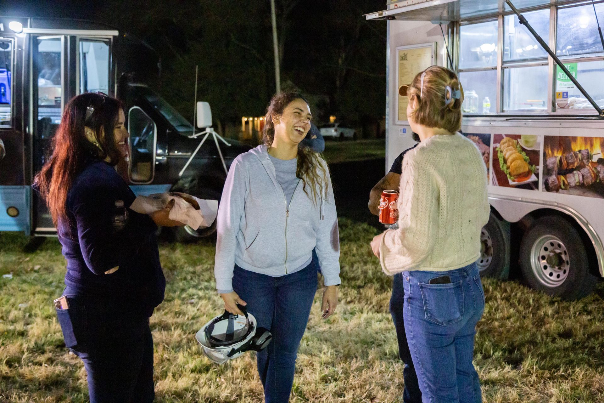 ICL family members are standing around talking.