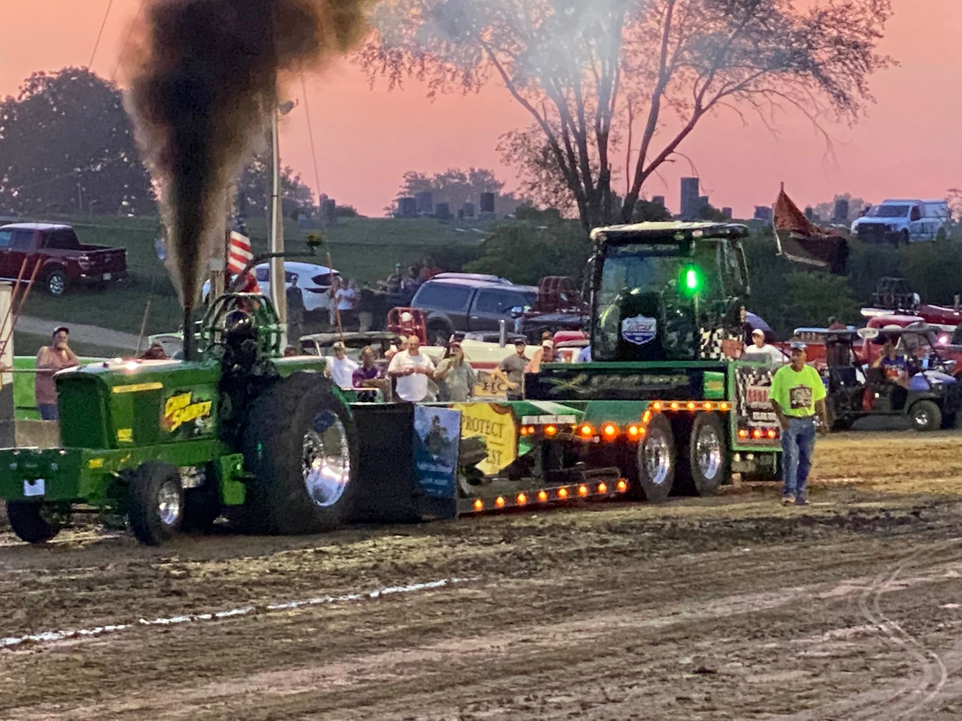 Tractors are sittinng on a road.