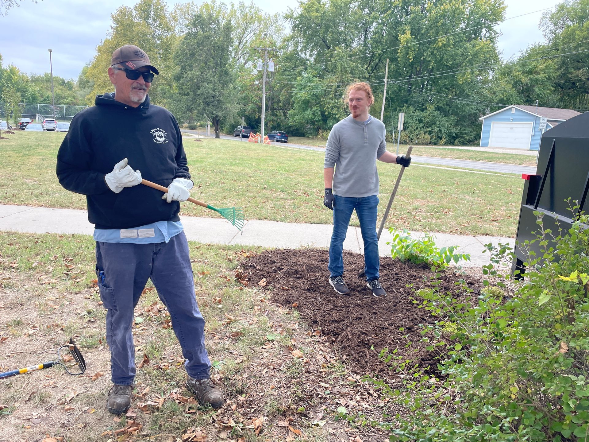 ICL employee is at Woodlawn Elementary school to help plant flowers.