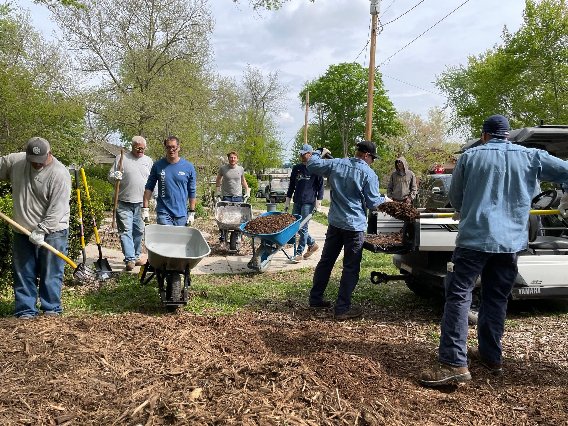 Men are working hard at the ICL community garden.