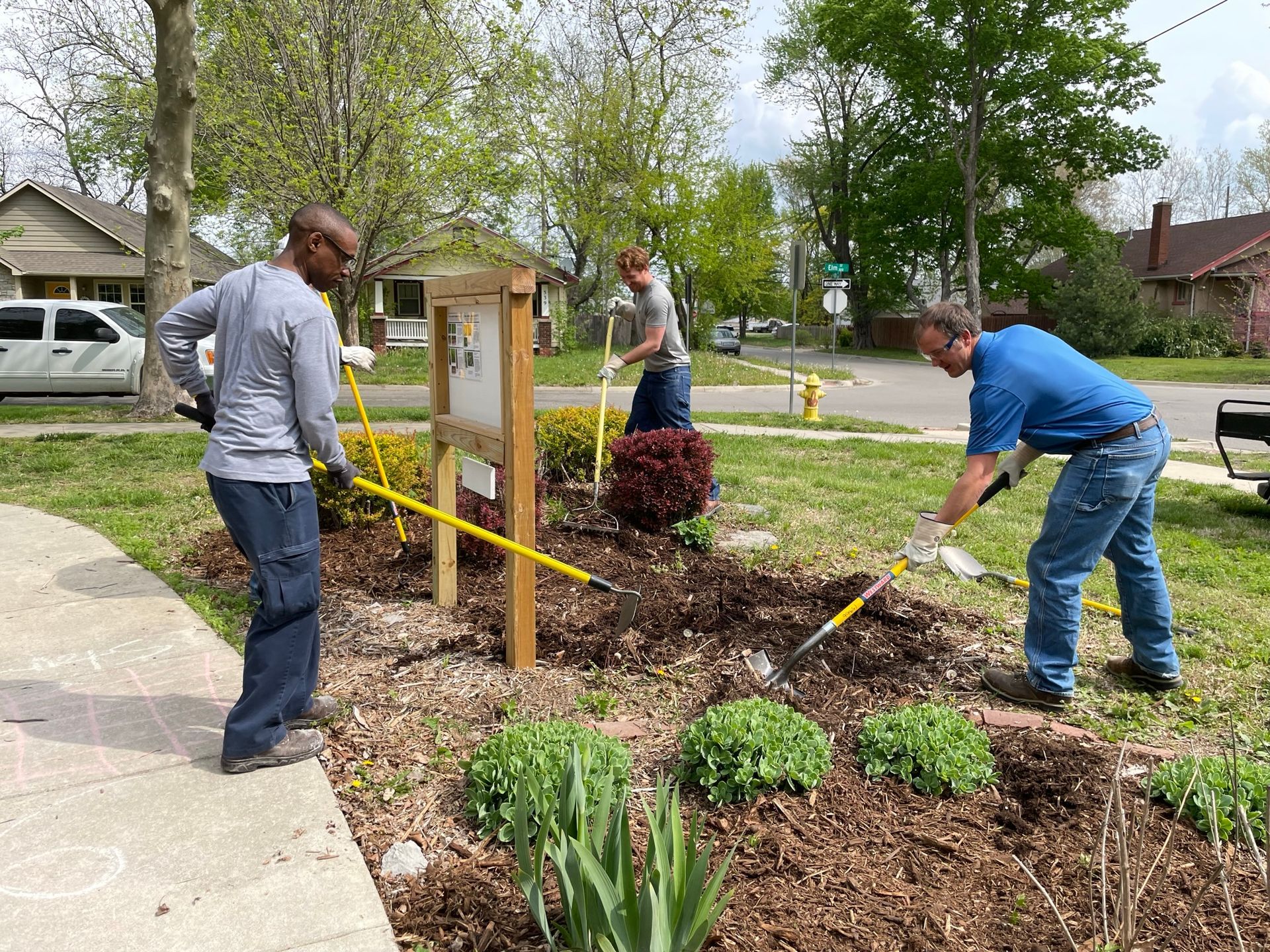 Men are working hard at the ICL community garden.