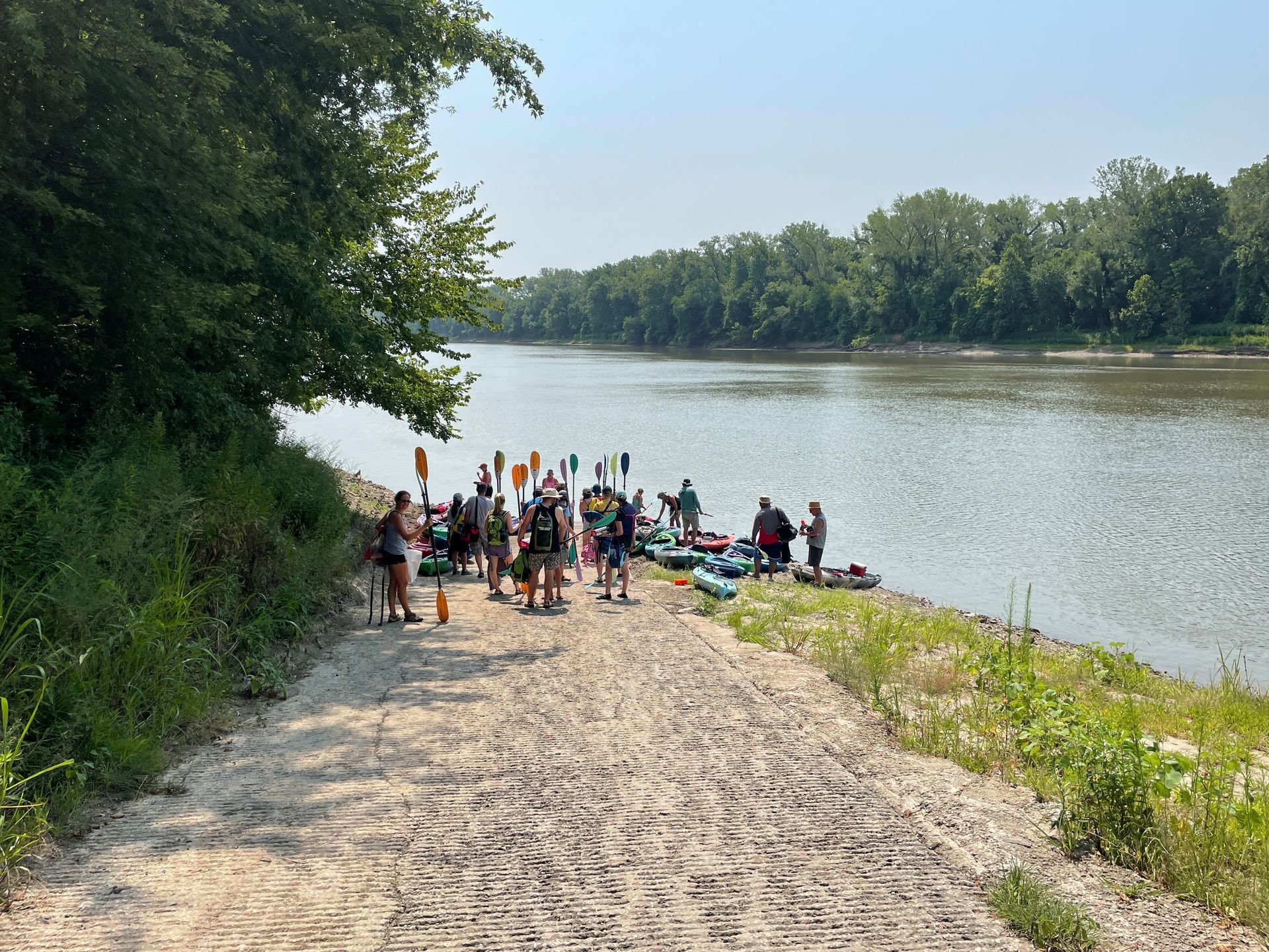 ICL employees are heading to the river to get in their boat to float down the river.
