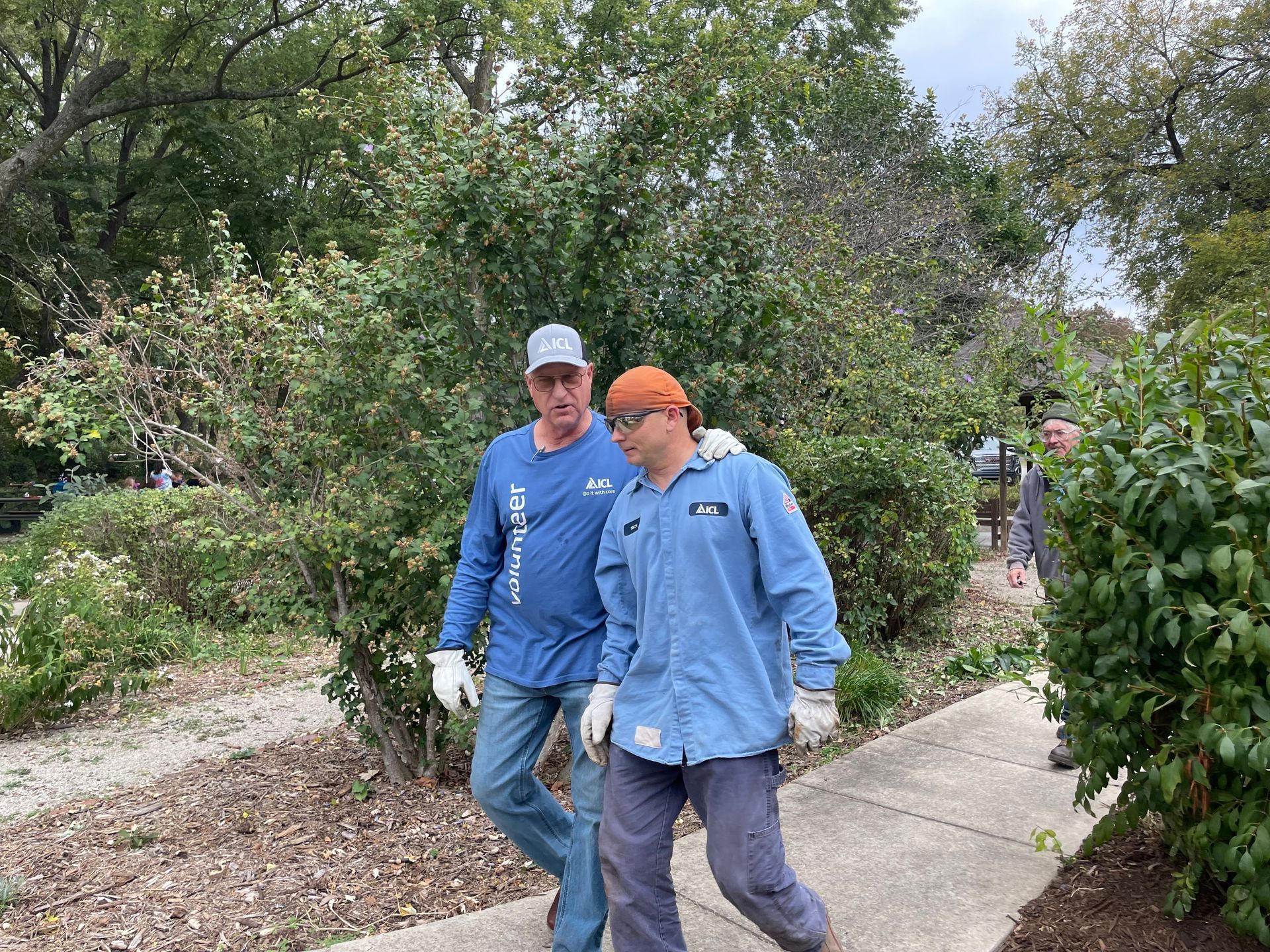ICL employee is at Woodlawn Elementary school to help plant flowers.