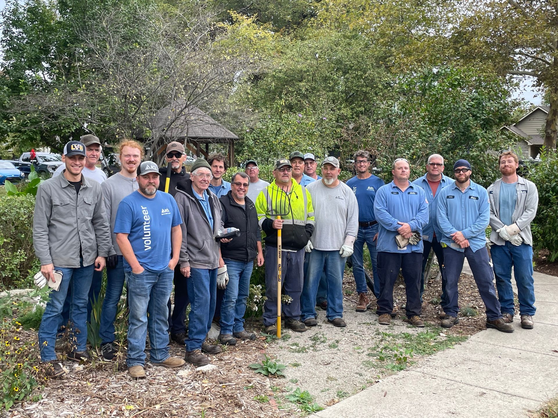 ICL employee is at Woodlawn Elementary school to help plant flowers.