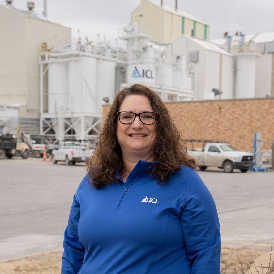 ICL employee smiles for the camera.
