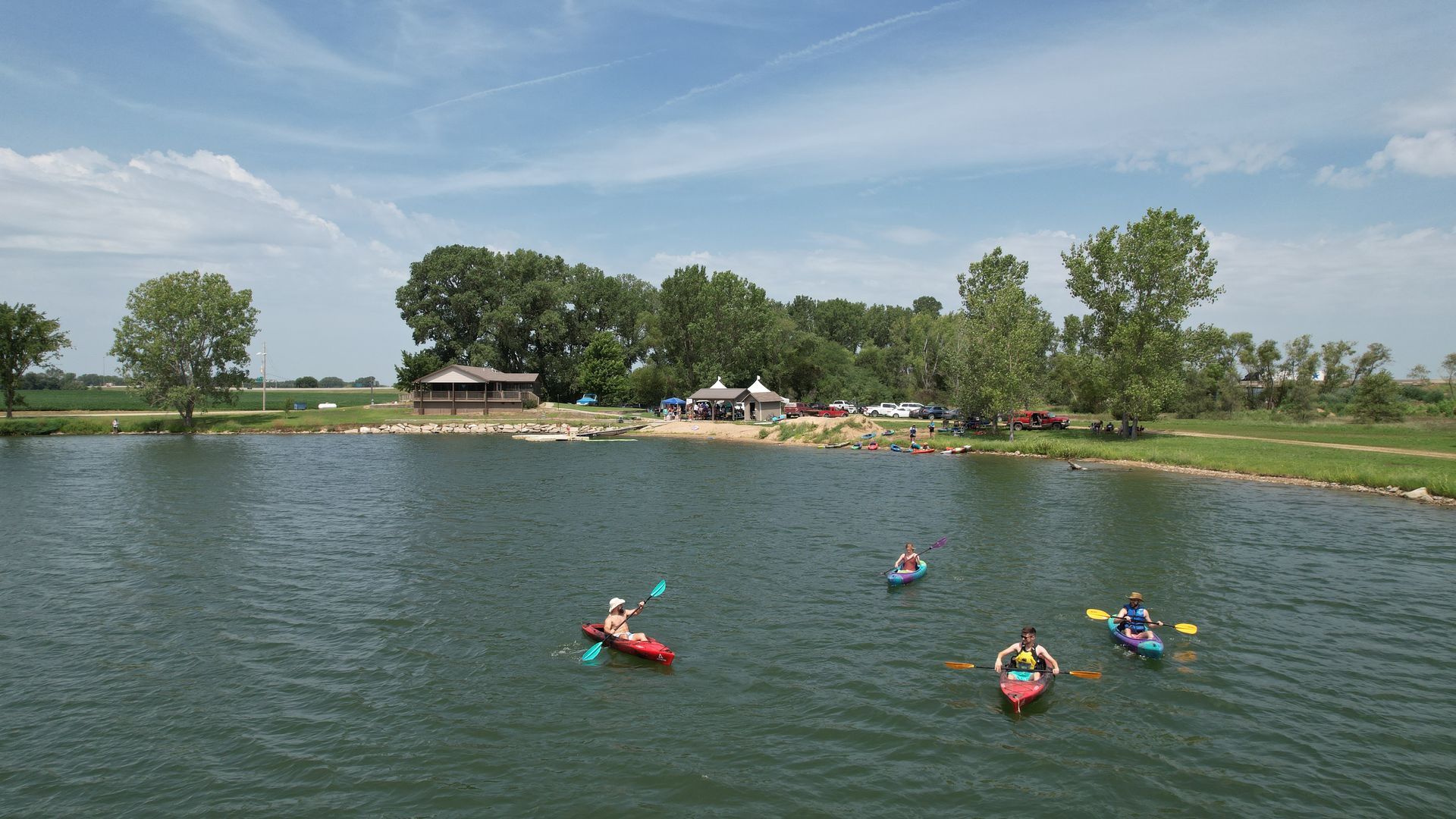People are kayaking around the lake. Arial view.