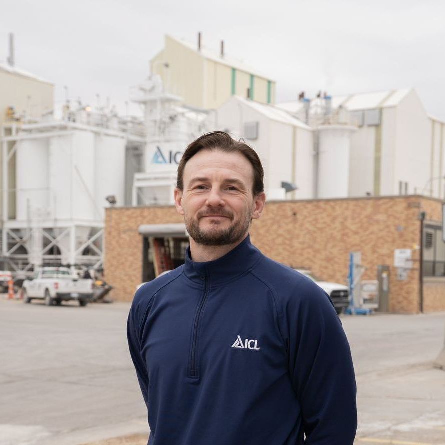 ICL employee smiles for the camera.