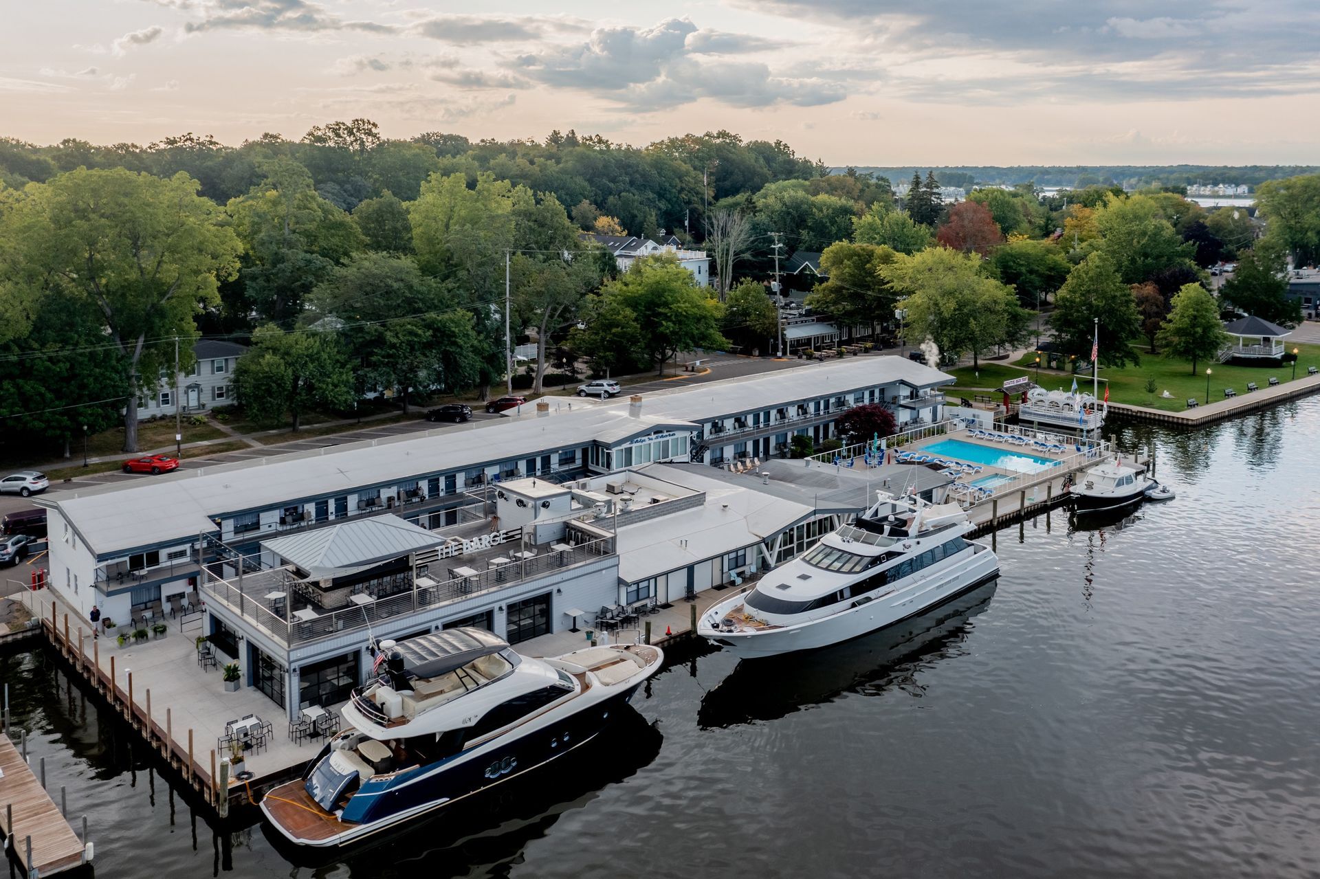 An aerial view of a marina with boats docked at a dock.