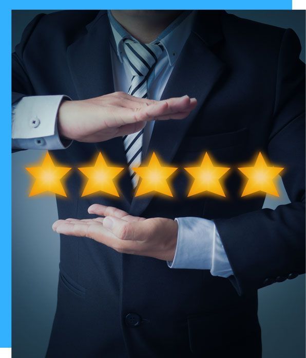 A man in a suit and tie is holding five stars in his hands
