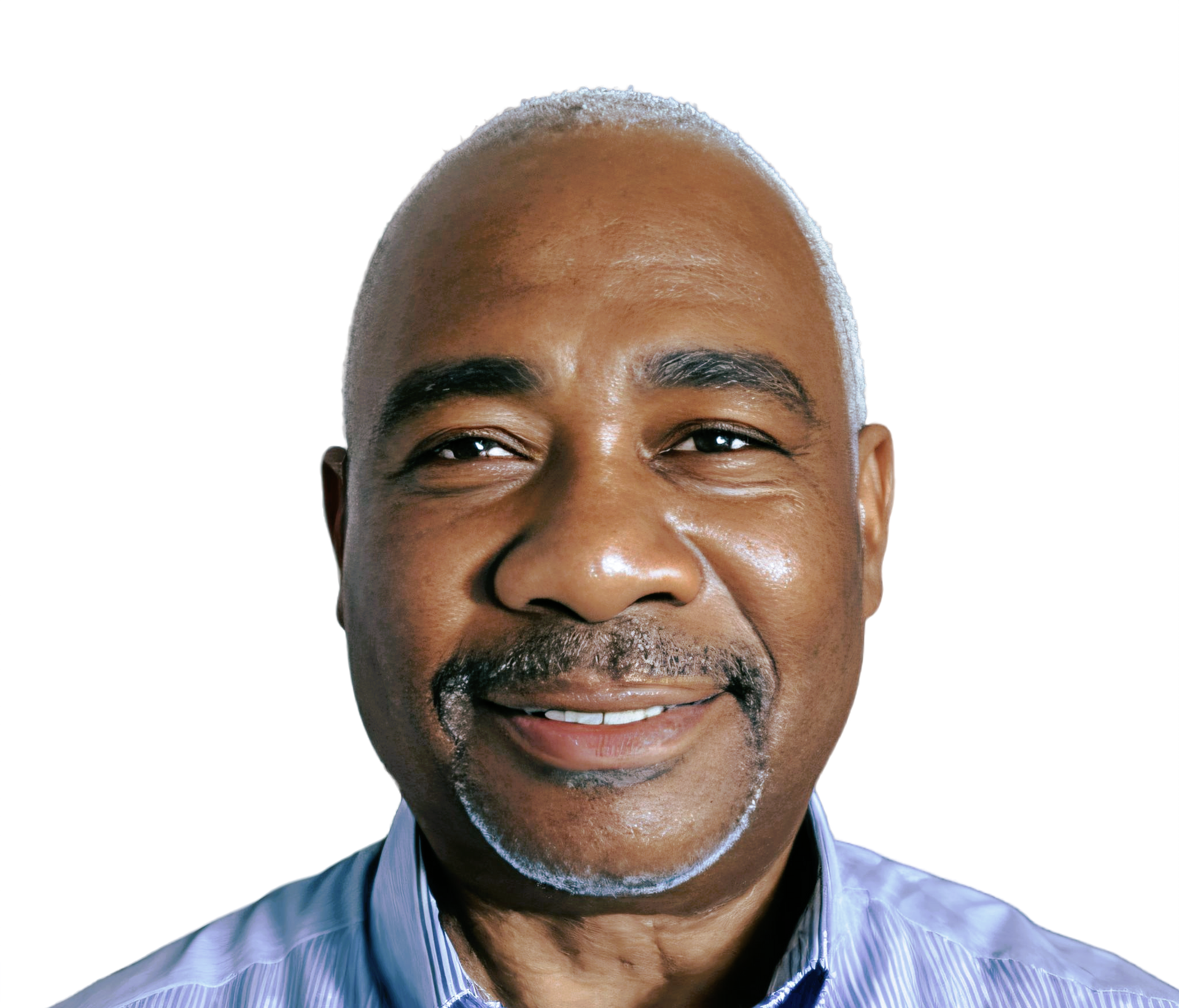 Smiling Black man with a shaved head and a graying goatee, wearing a blue collared shirt, against a white background.