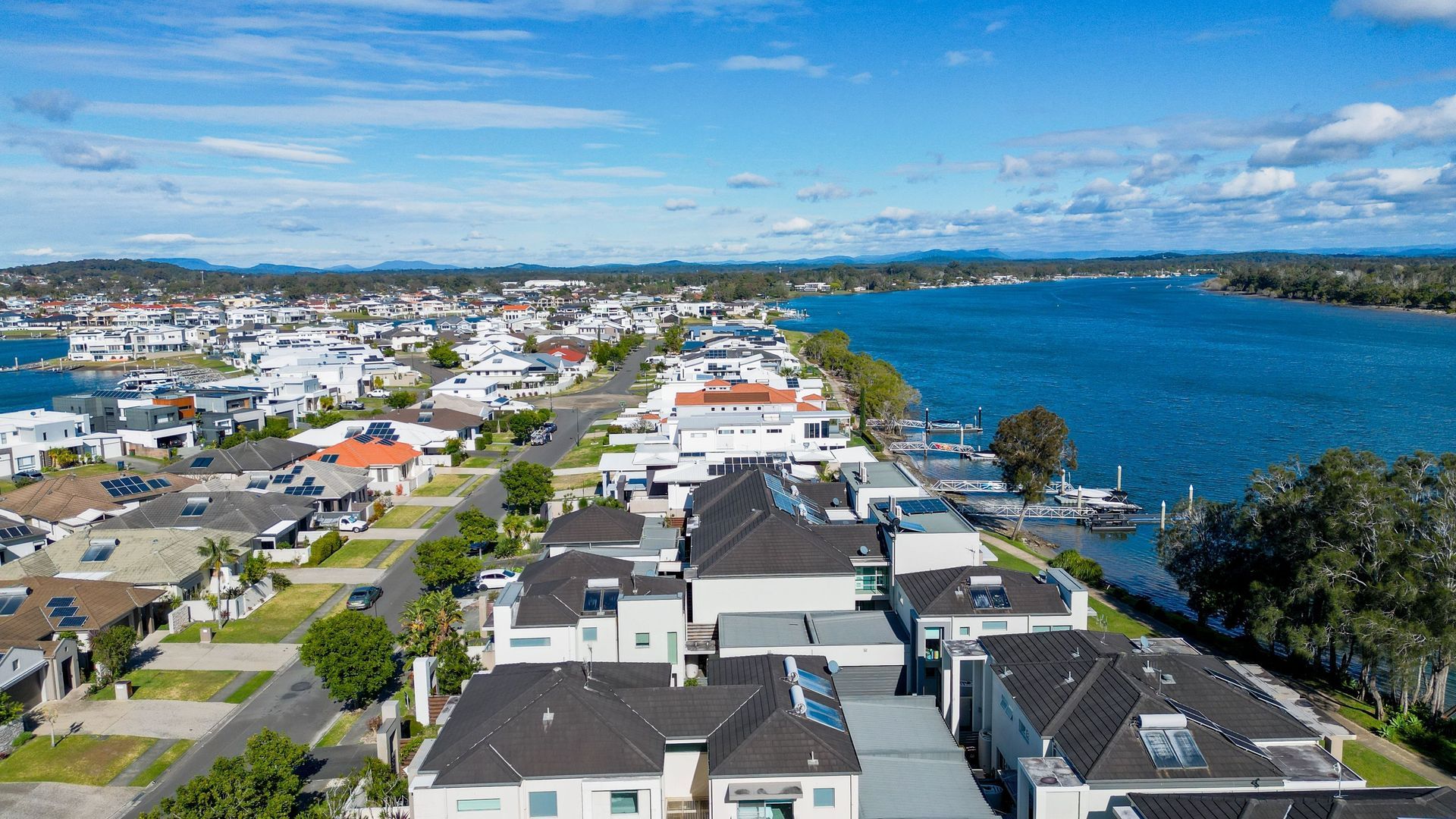 An Aerial View Of A Residential Area Next To A Body Of Water — Dentures Direct Taree-Rod Hinton In Port Macquarie, NSW