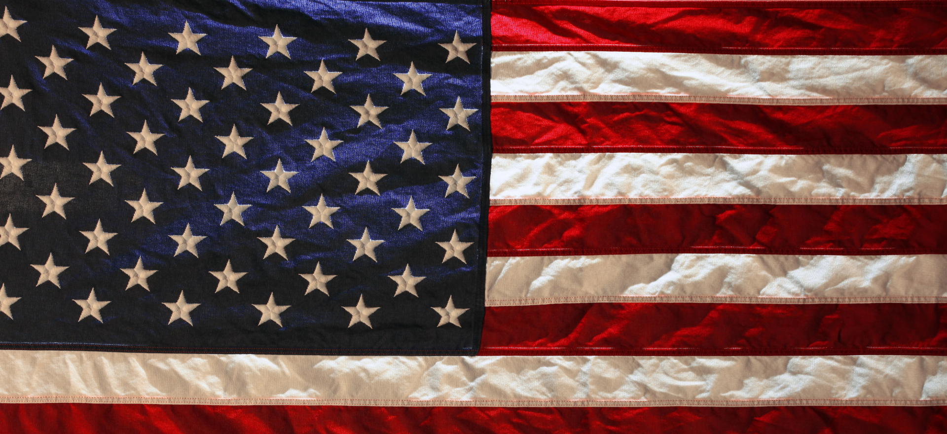 A close up of an american flag with stars on it