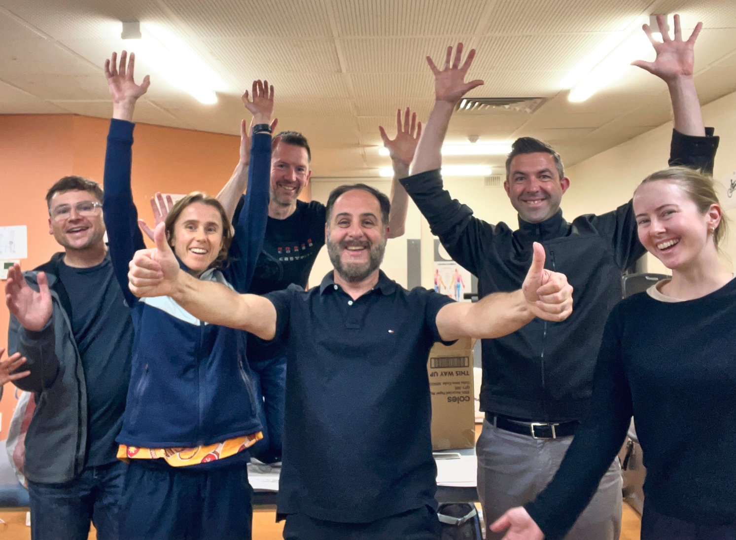 Tito and students smiling at the end of a workshop