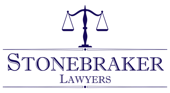 Stonebraker Lawyers logo with a scale of justice icon in navy blue.