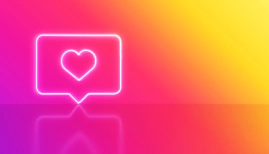 Instagram Farbverlauf im Hintergrund mit weissem Neon-Herz im Vordergrund