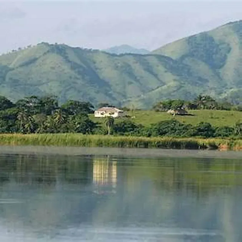 Natural landscape of Laguna Limón with mountain reflections and tropical vegetation in Miches, Dominican Republic