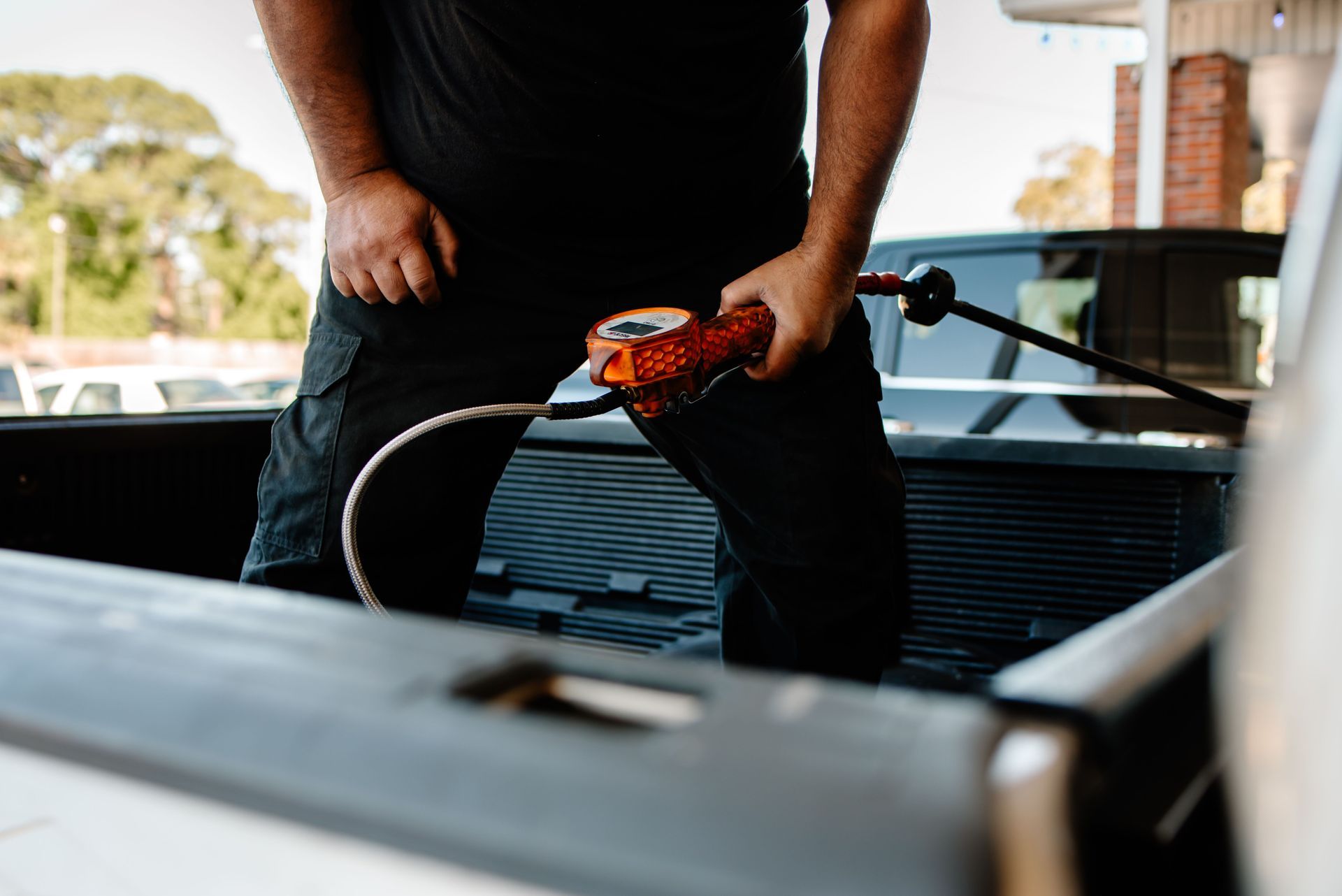 A man is sitting at a desk in front of a computer.