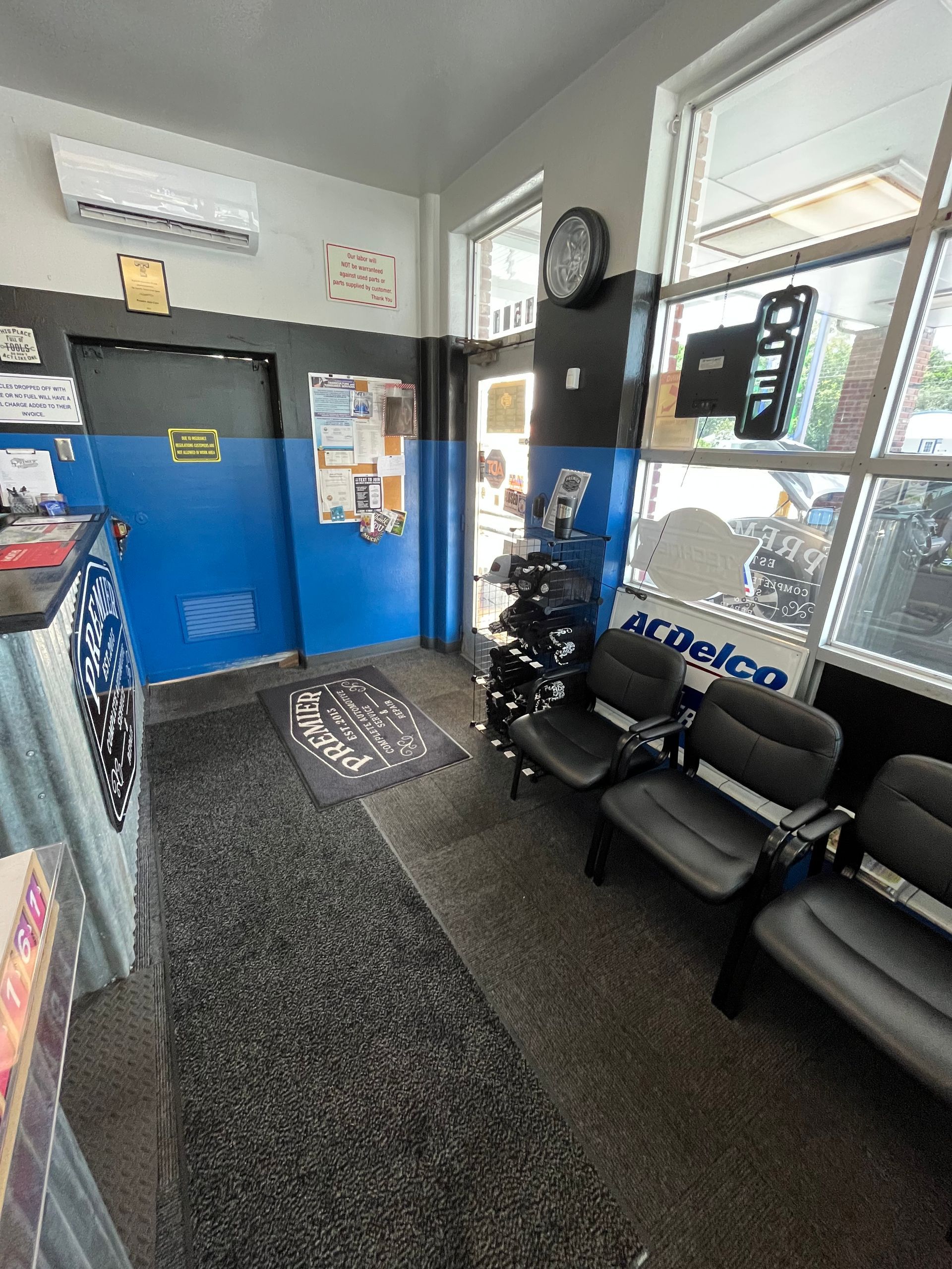 A waiting room with a sign that says acdelco on it.