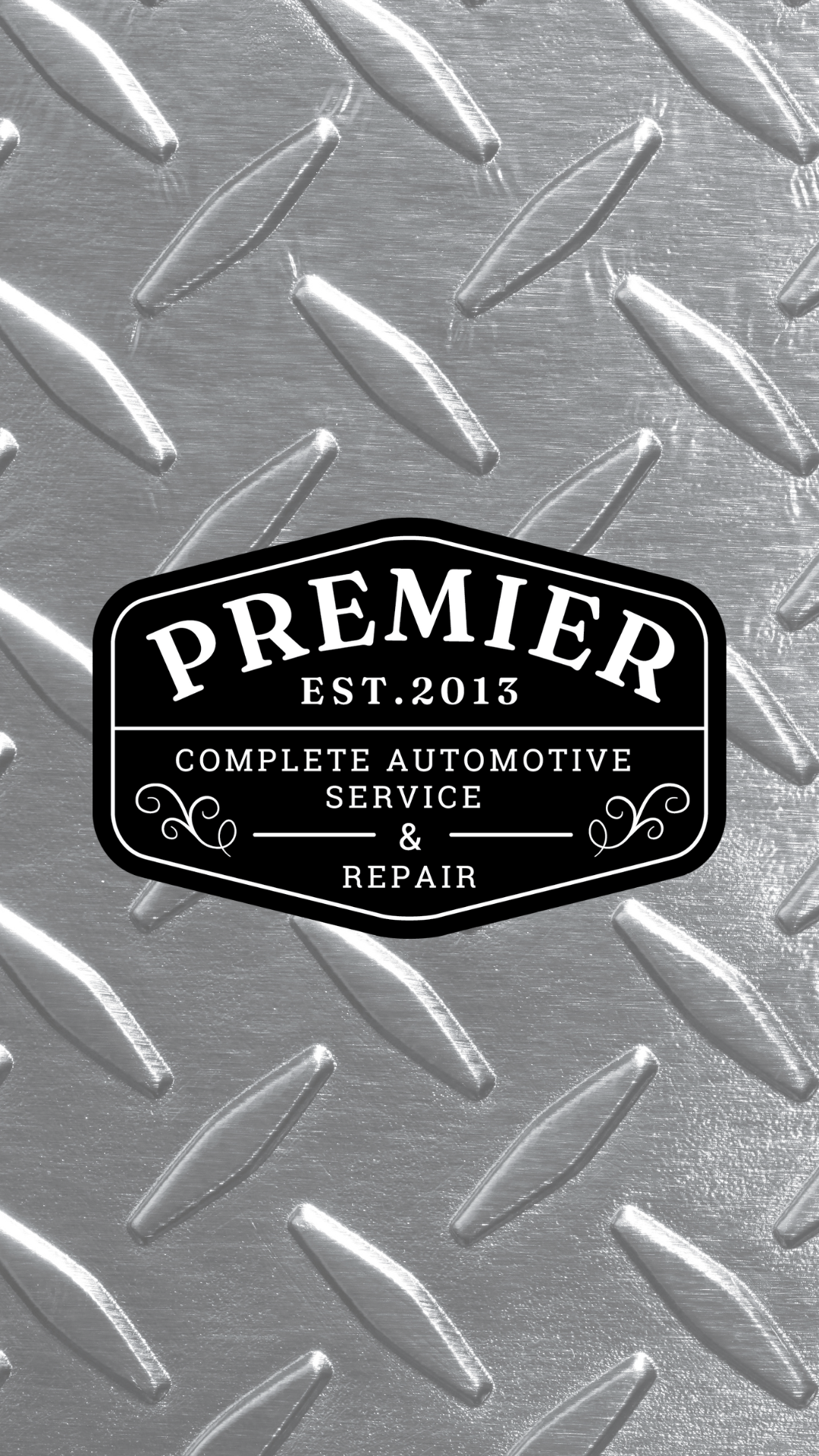 The logo for premier complete automotive service and repair is on a metal background.
