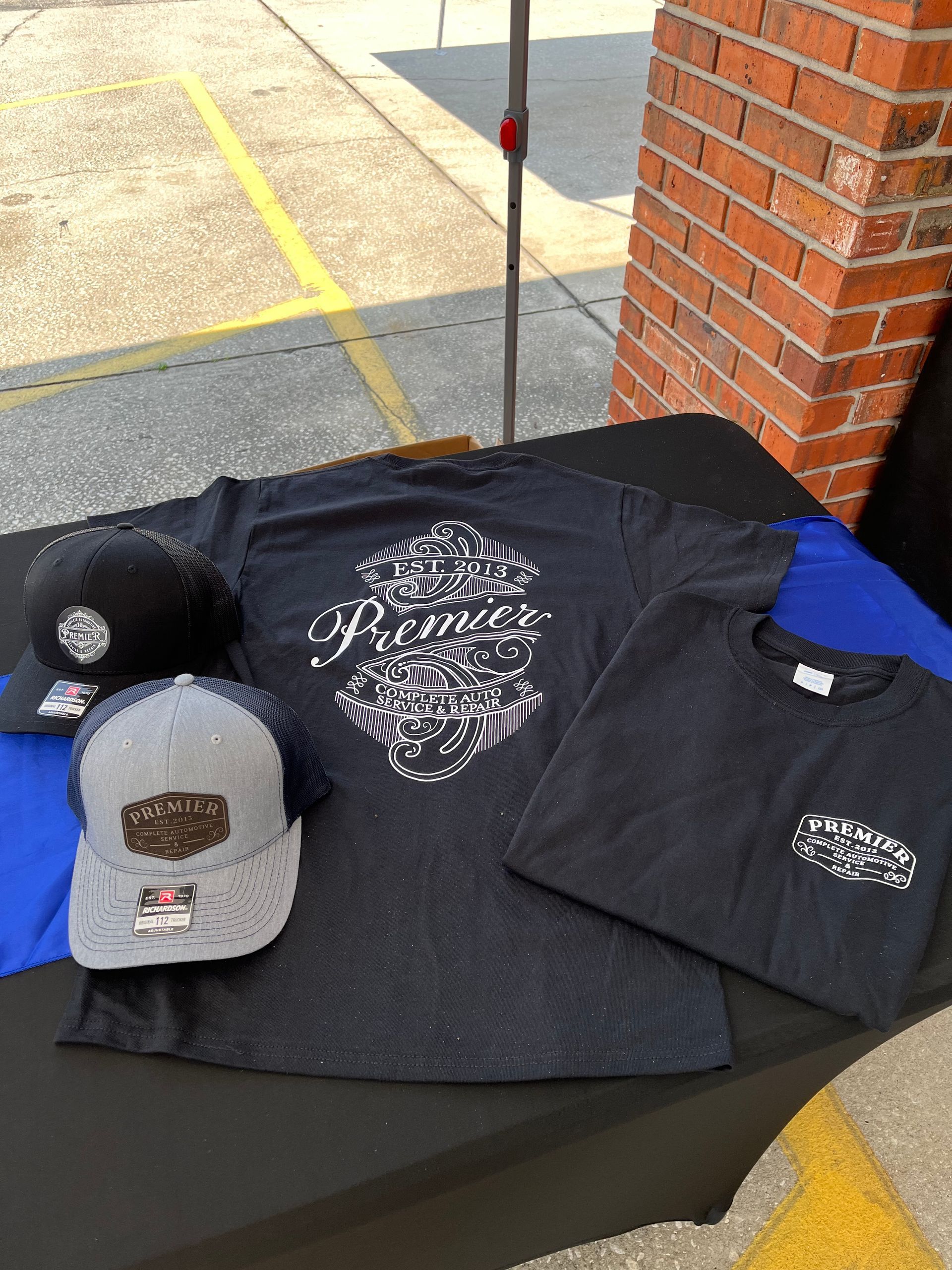 A table with a hat , t-shirt , and hat on it.