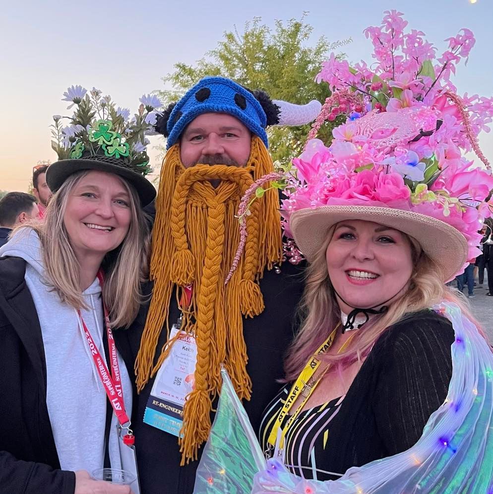 A man with a beard wearing a hat with flowers on it