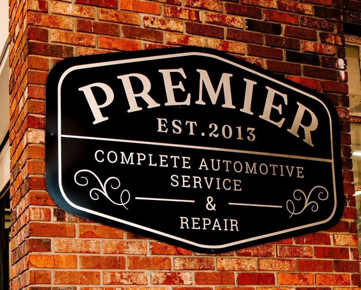 A car is in a garage at premier auto care