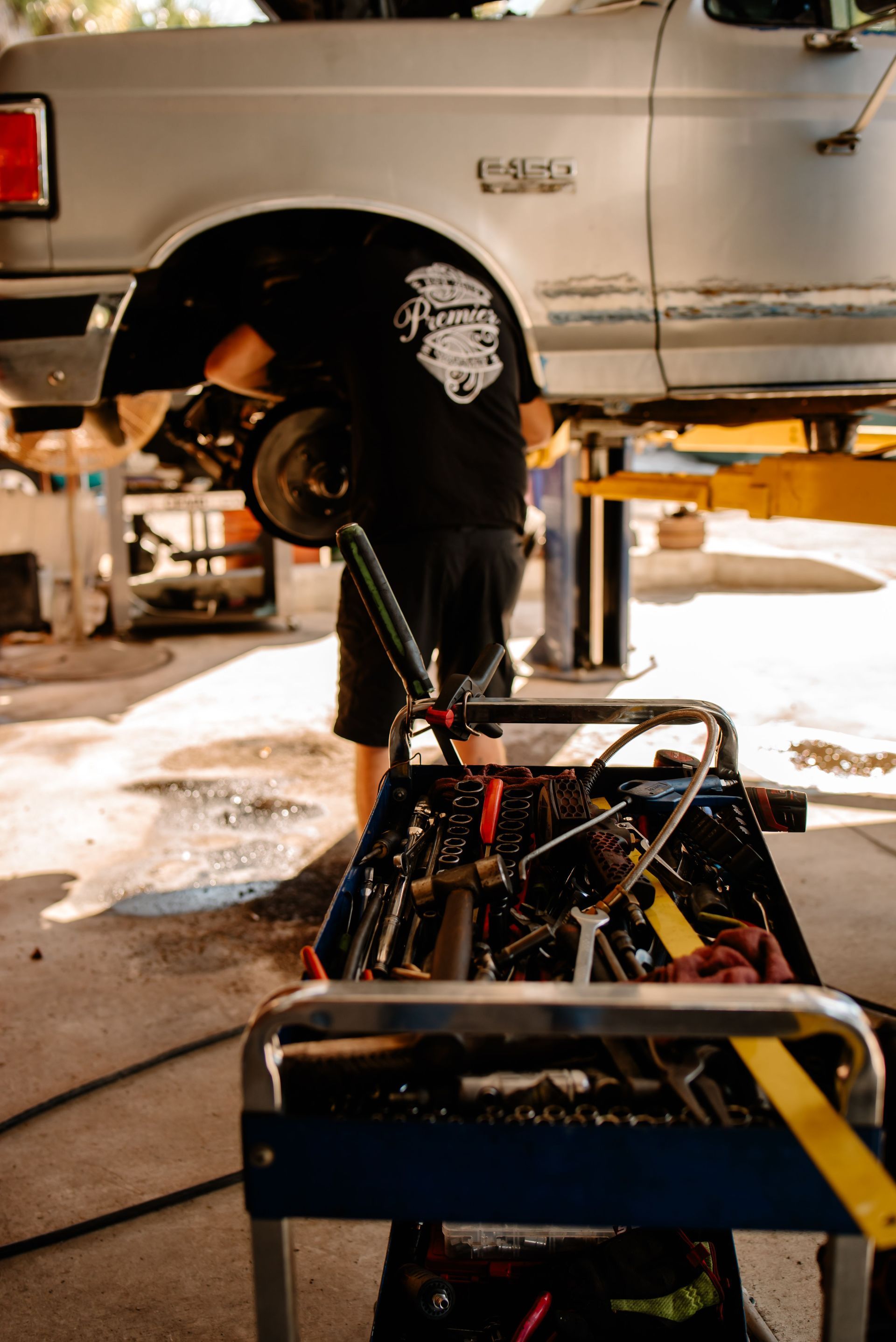 A white van is parked in front of a building.
