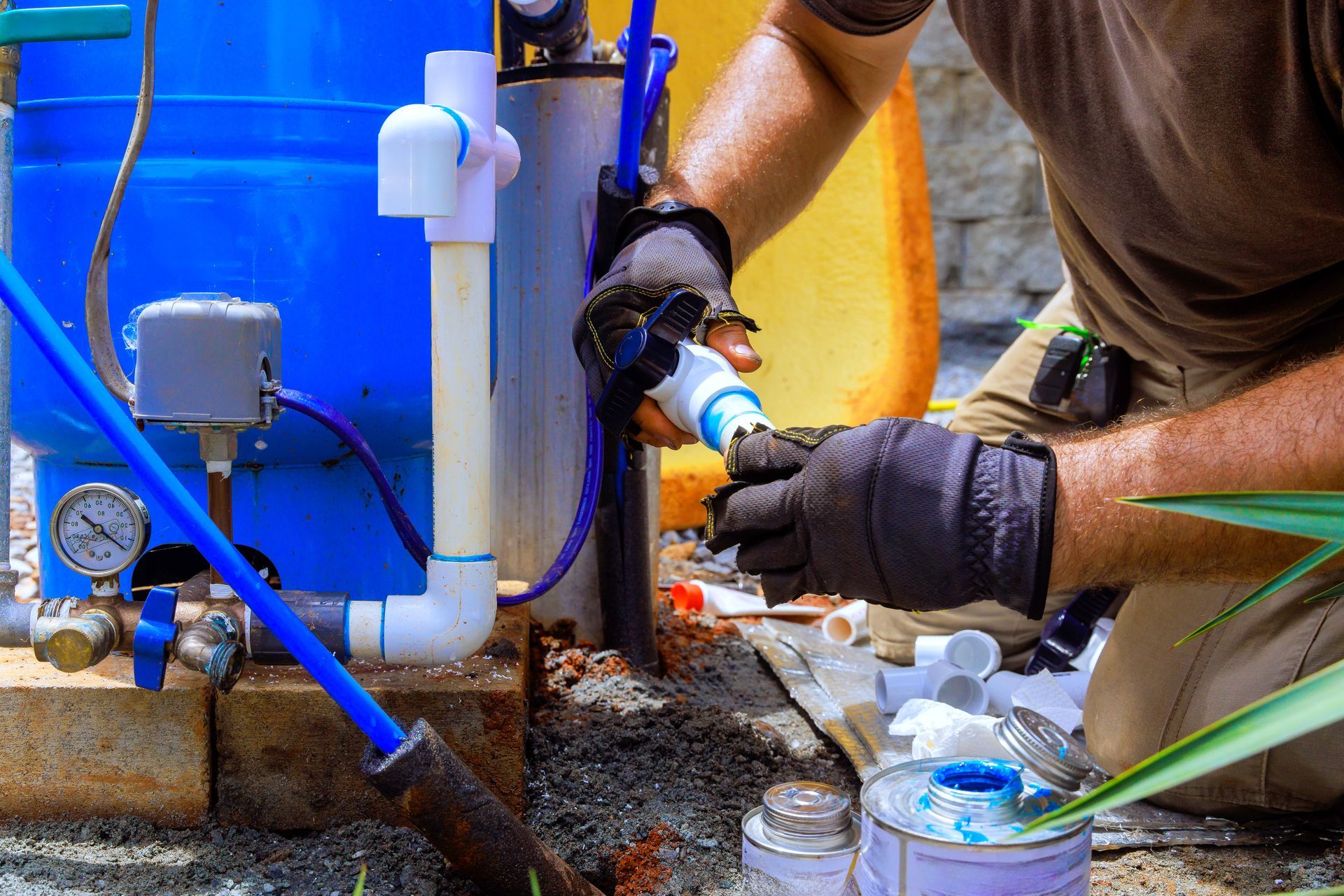 Plumbing work assembling connection between water well water system at house. Plumbing work assembling connection between water well water system at house.