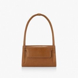 A brown leather purse with a handle on a white background