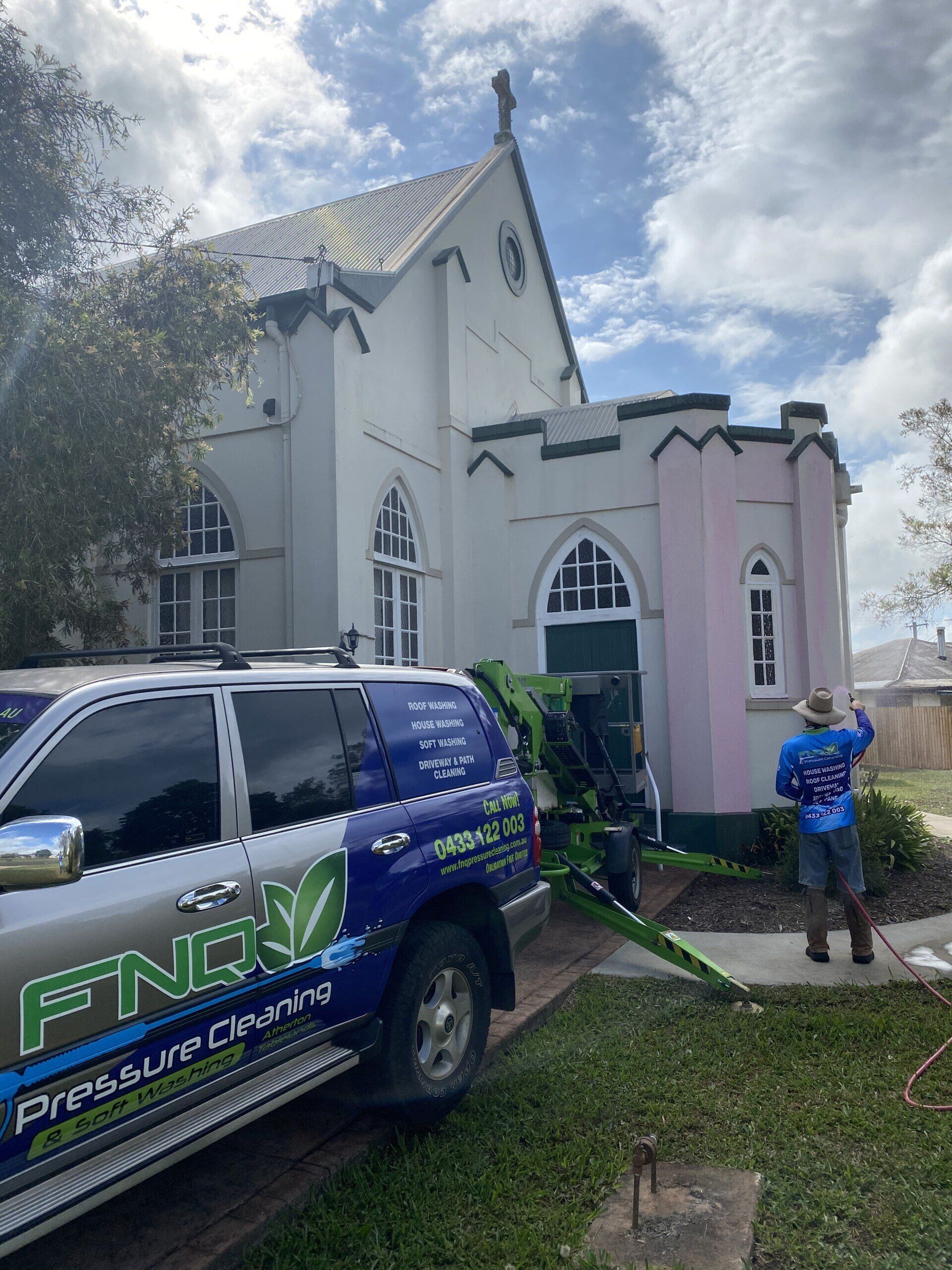 Man Cleaning The Front Of The Church — FNQ Pressure Cleaning  in Atherton, QLD