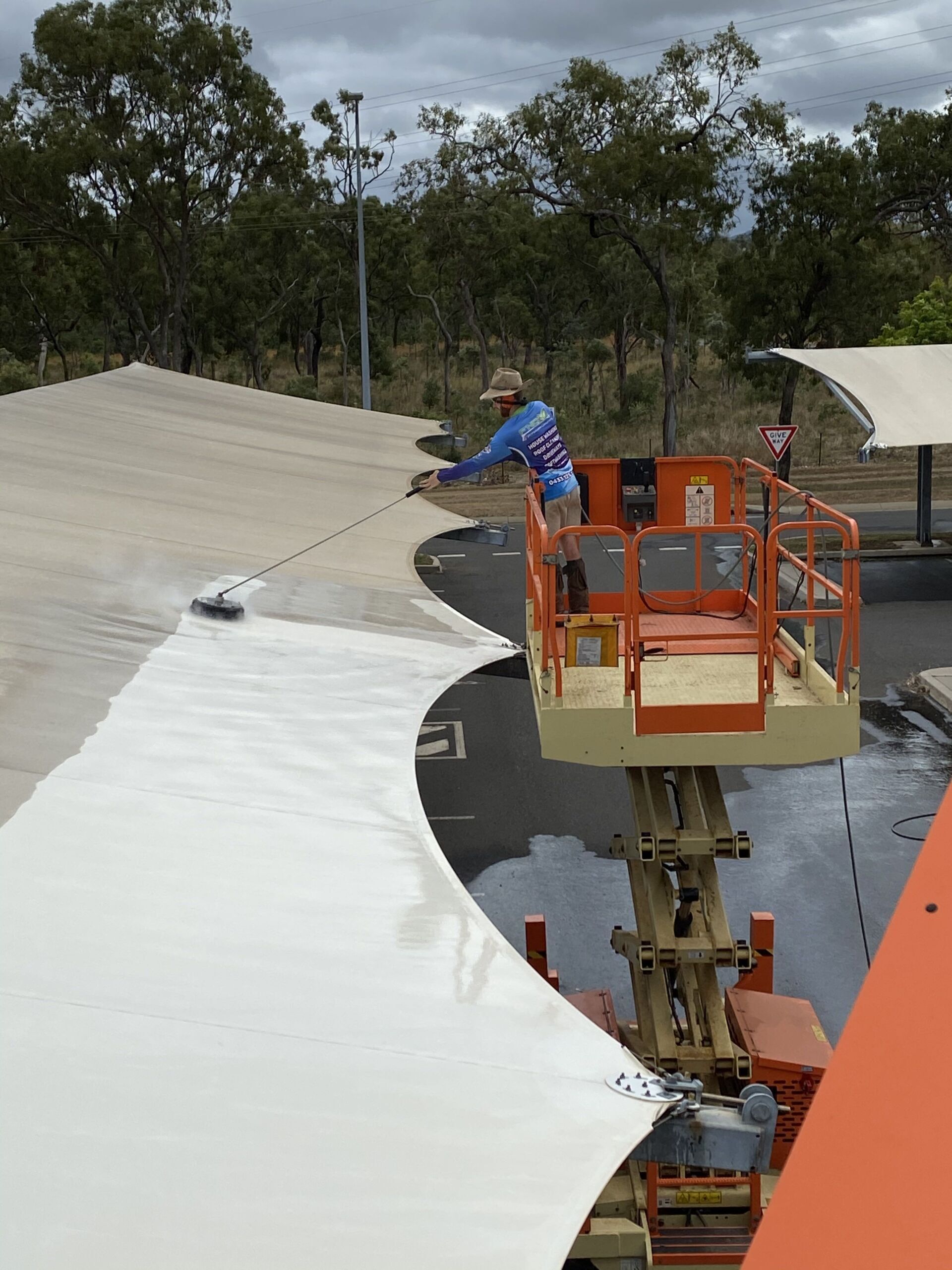 Close Up View Of Man Cleaning The Tent — FNQ Pressure Cleaning  in Atherton, QLD