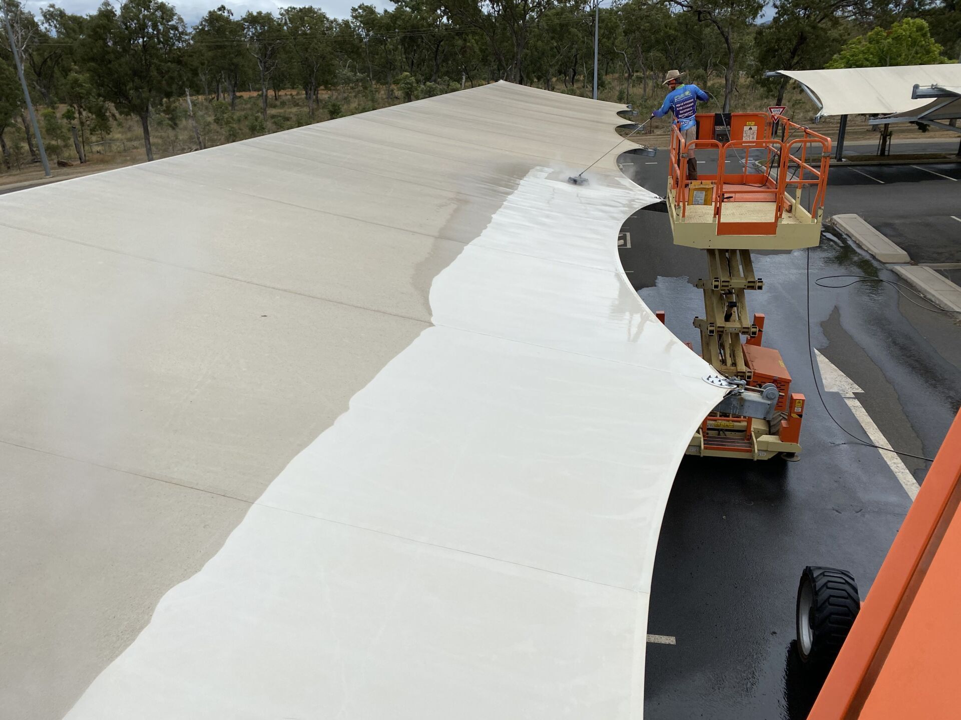 Man Cleaning The Tent — FNQ Pressure Cleaning  in Atherton, QLD