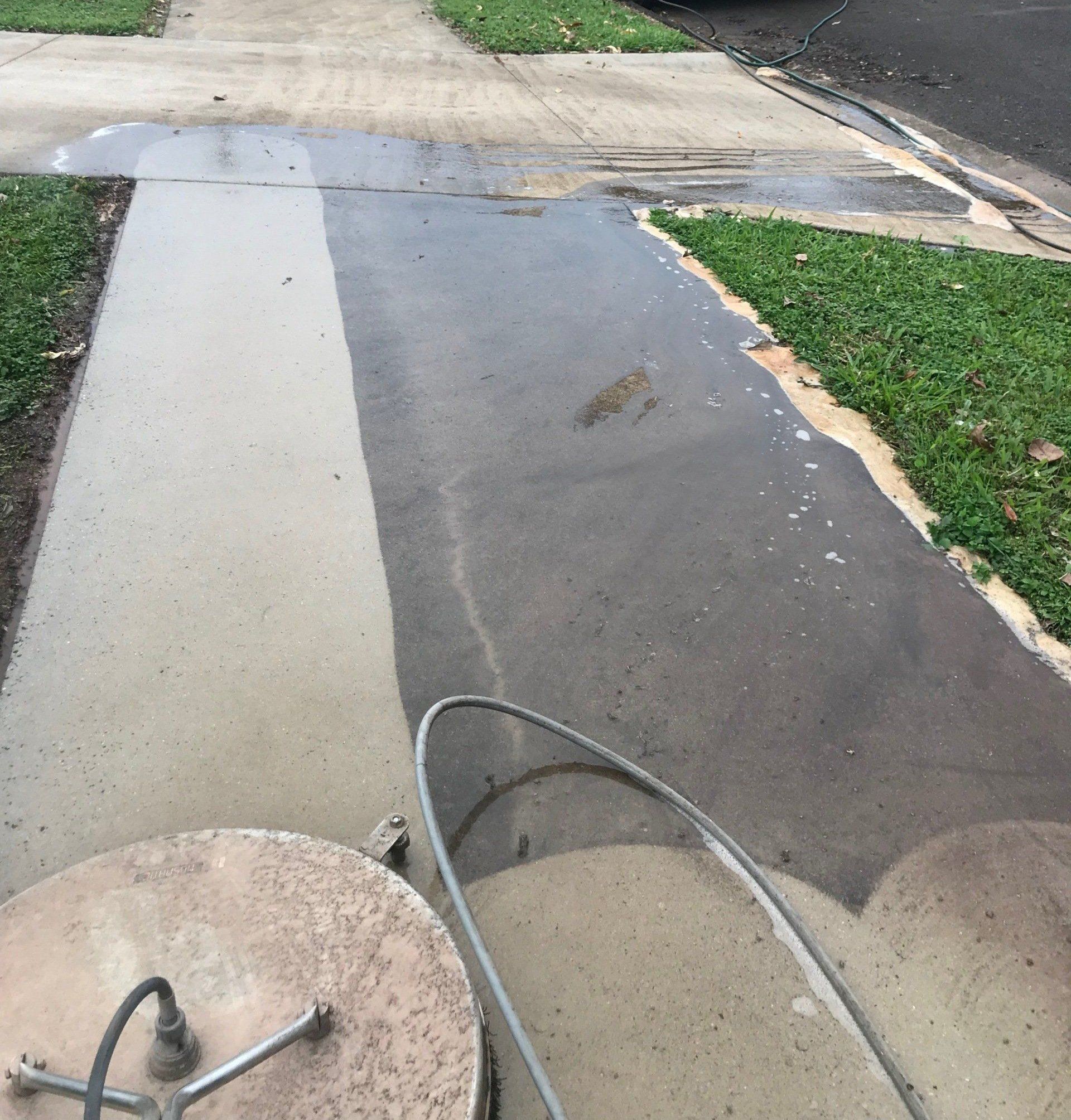 Man Cleaning Terrace with a Power Washer — FNQ Pressure Cleaning  in Atherton, QLD