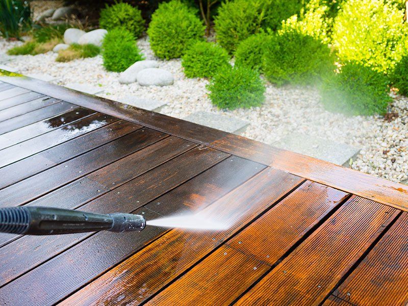 Cleaning Terrace with a Power Washer — FNQ Pressure Cleaning  in Atherton, QLD