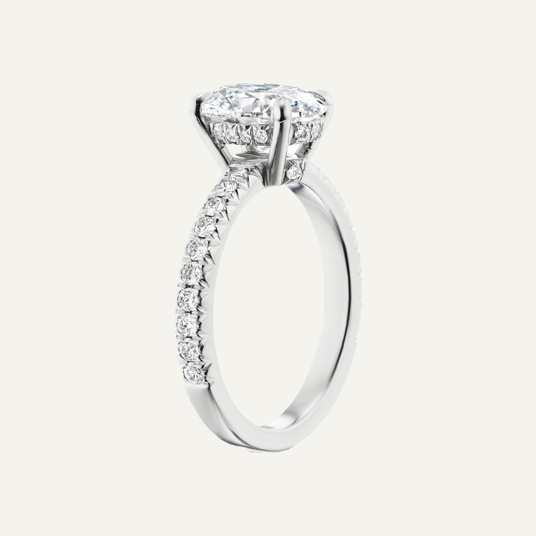 Platinum pave set under-bezels and shank,  2.76ct round diamond center