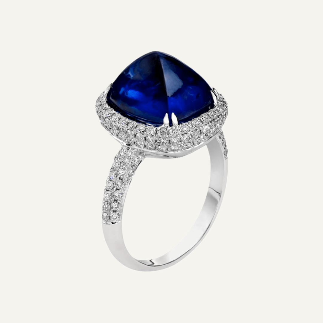 7.65ct Sugarloaf cut Sapphire, double diamond pave set shank and halo