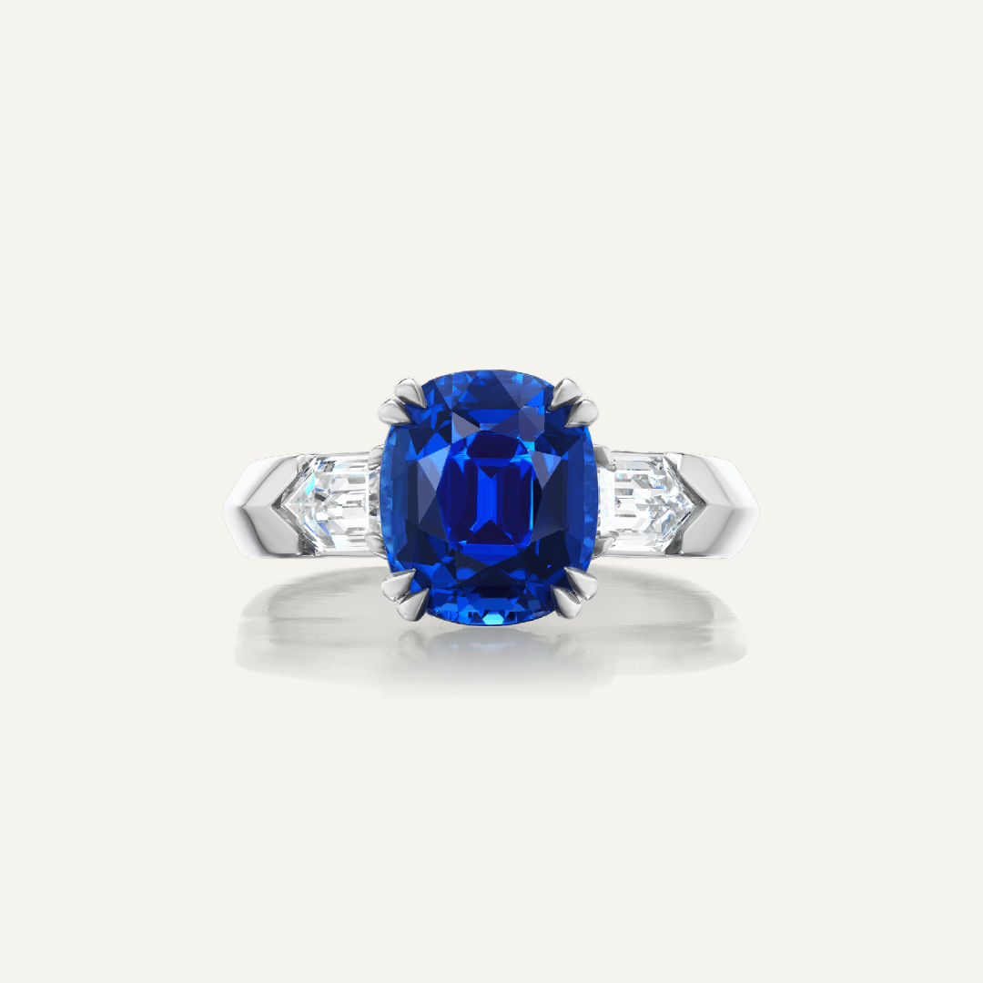 5.75ct Oval Sapphire w/ chisel point diamond sides