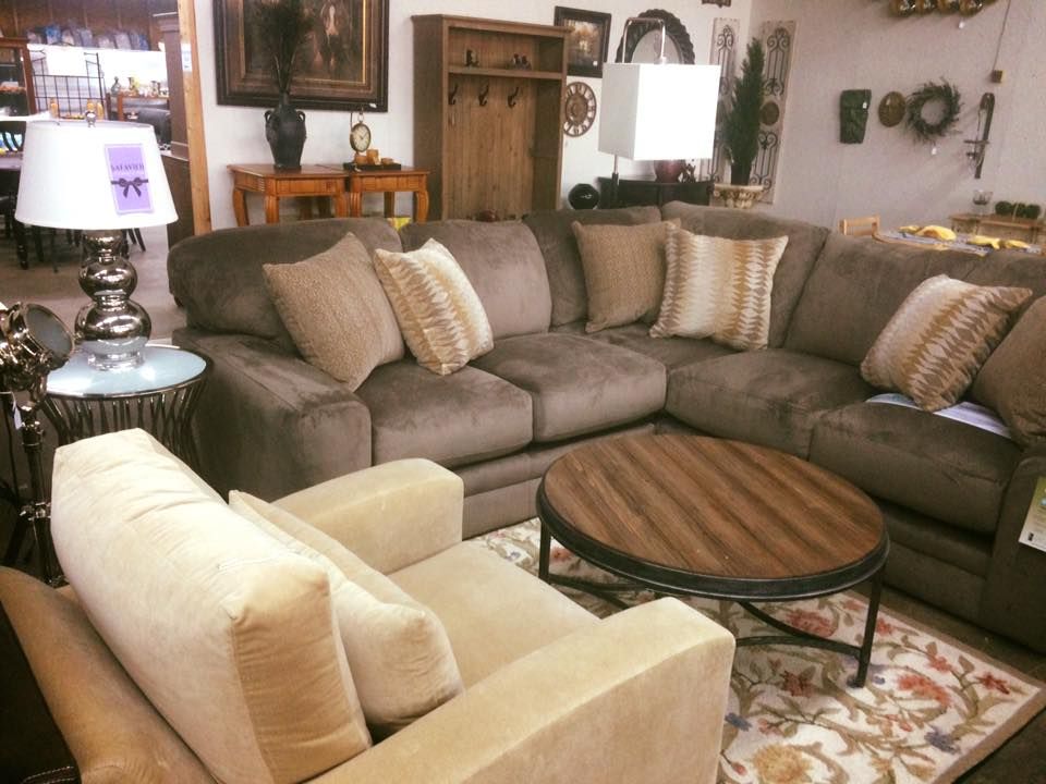 A living room filled with furniture and a coffee table.