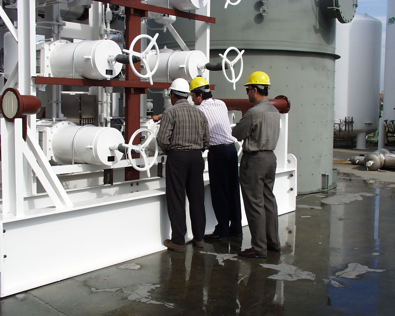 Engineers Checking the LNG Tank Pipes and Valve