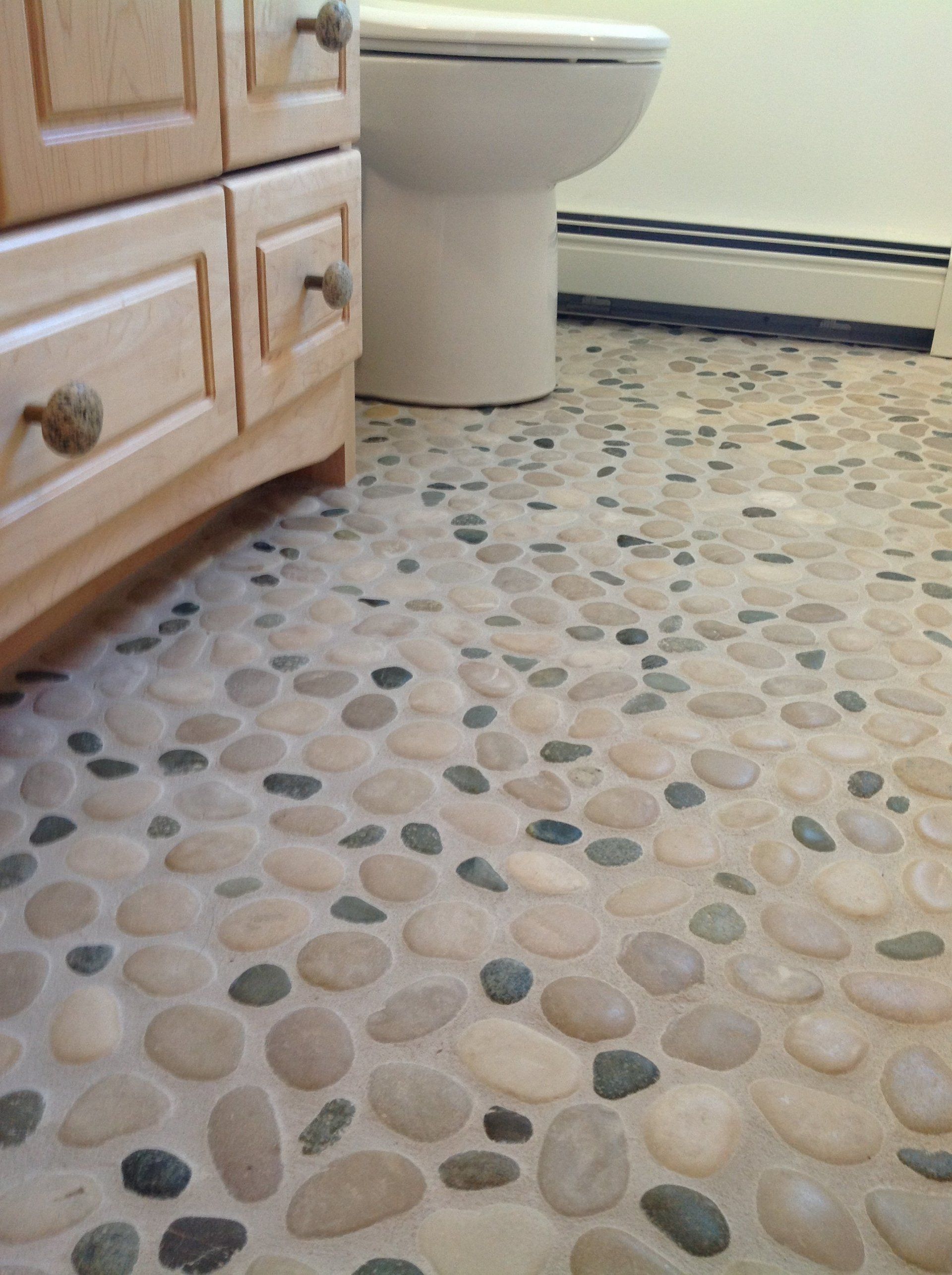 Pebbles on the floor for a spa like bathroom